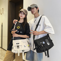 メッセンジャーバッグ 日本の男女兼用トレンドブランド カジュアルショルダーバッグ カジュアル 万能 通勤 テクスチャー 大容量バッグ 女性用 クロスボーダー