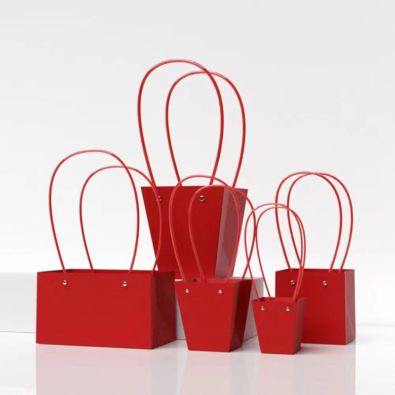 Fábrica de fiestas de flores al por mayor kraft bolsa de papel de flores macaron color floral portátil cesta de regalo DIY bolsa de papel