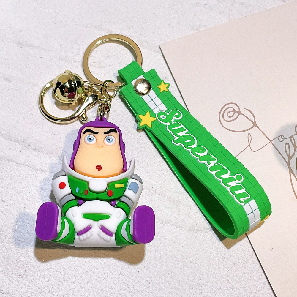 Llavero de silicona de Toy Story, el popular dibujo animado, con personajes como el alienígena de tres ojos, Buzz Lightyear y el oso Lotso, ideal como adorno para bolso.