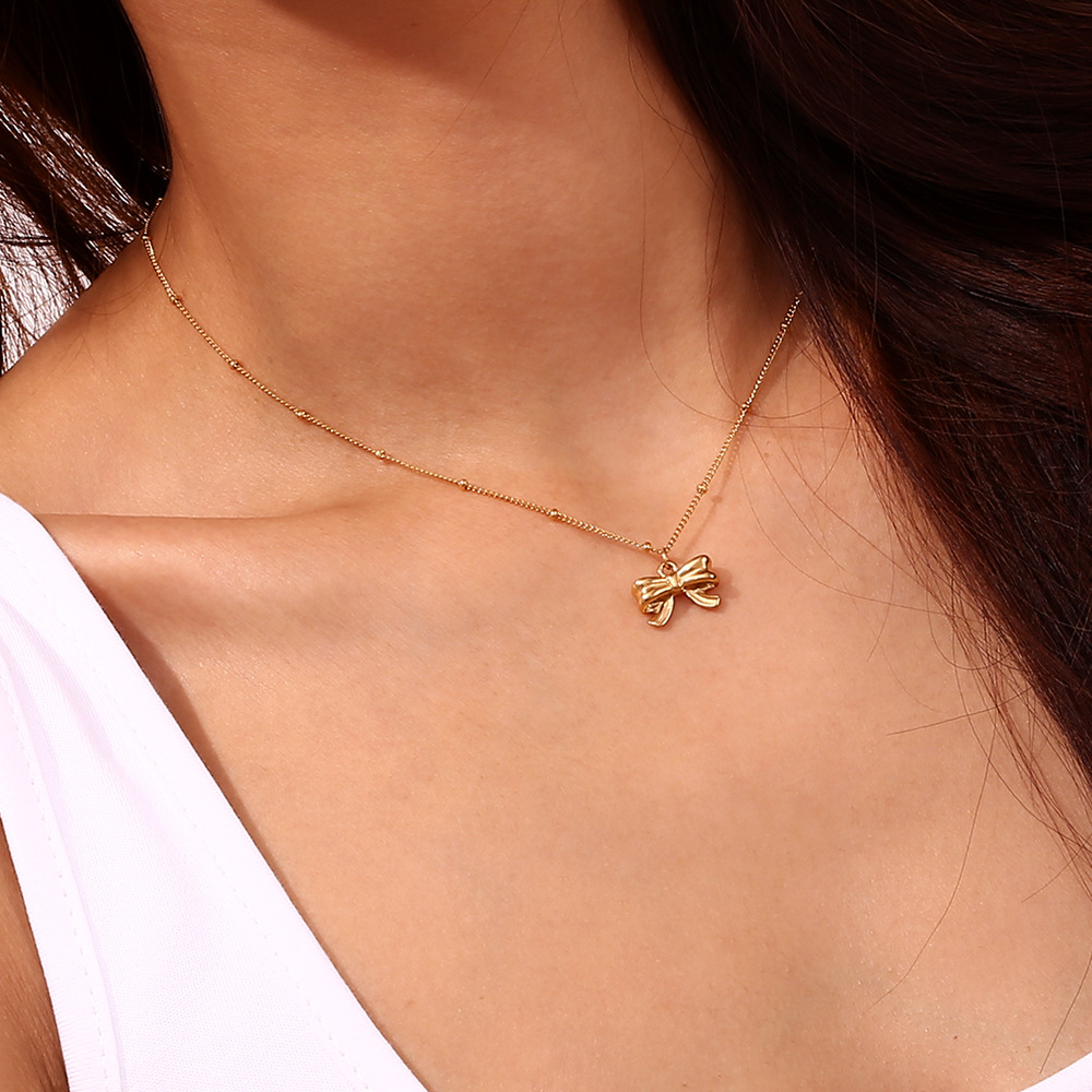 10g Weight 0.03µm-0.05µm Gold Plating Thickness PVD Coated Gold Plating Process 18K Real Gold Plated Plating Material Stone-Free Inlay Material Earrings, Necklace Classification Earrings + Necklace Quantity Daily Occasion 304 Stainless Steel Material Bow Knot Pattern Women's Gender Elegant Style Waterproof Non Tarnish Craft PVD Coated Real Gold Plated 18K Gold Bow Knot 316L Stainless Steel  Elegant Waterproof Non Tarnish Surgical Steel Earrings Necklace 9