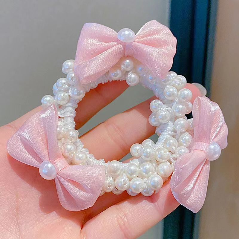 Pink yarn bow pearl hair circle