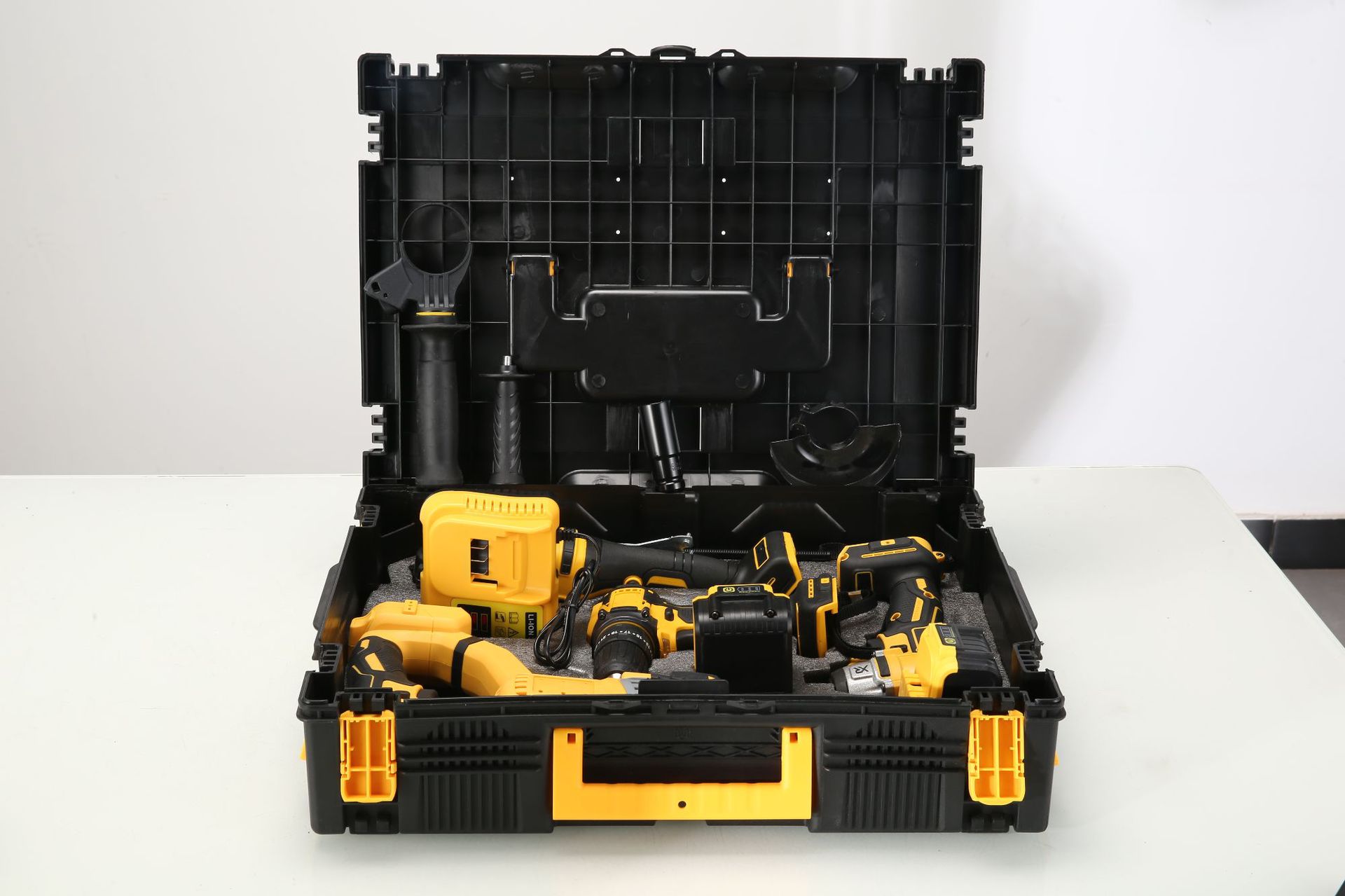 Al por mayor transfronterizo 4 piezas de herramientas eléctricas 4 piezas de litio taladro eléctrico martillo eléctrico molino de ángulo llave eléctrica