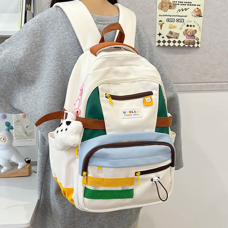 Mochila de gran capacidad 2024 nueva mochila de color en contraste para estudiantes al aire libre viajes de ocio mochila de todo fósforo para mujeres al por mayor