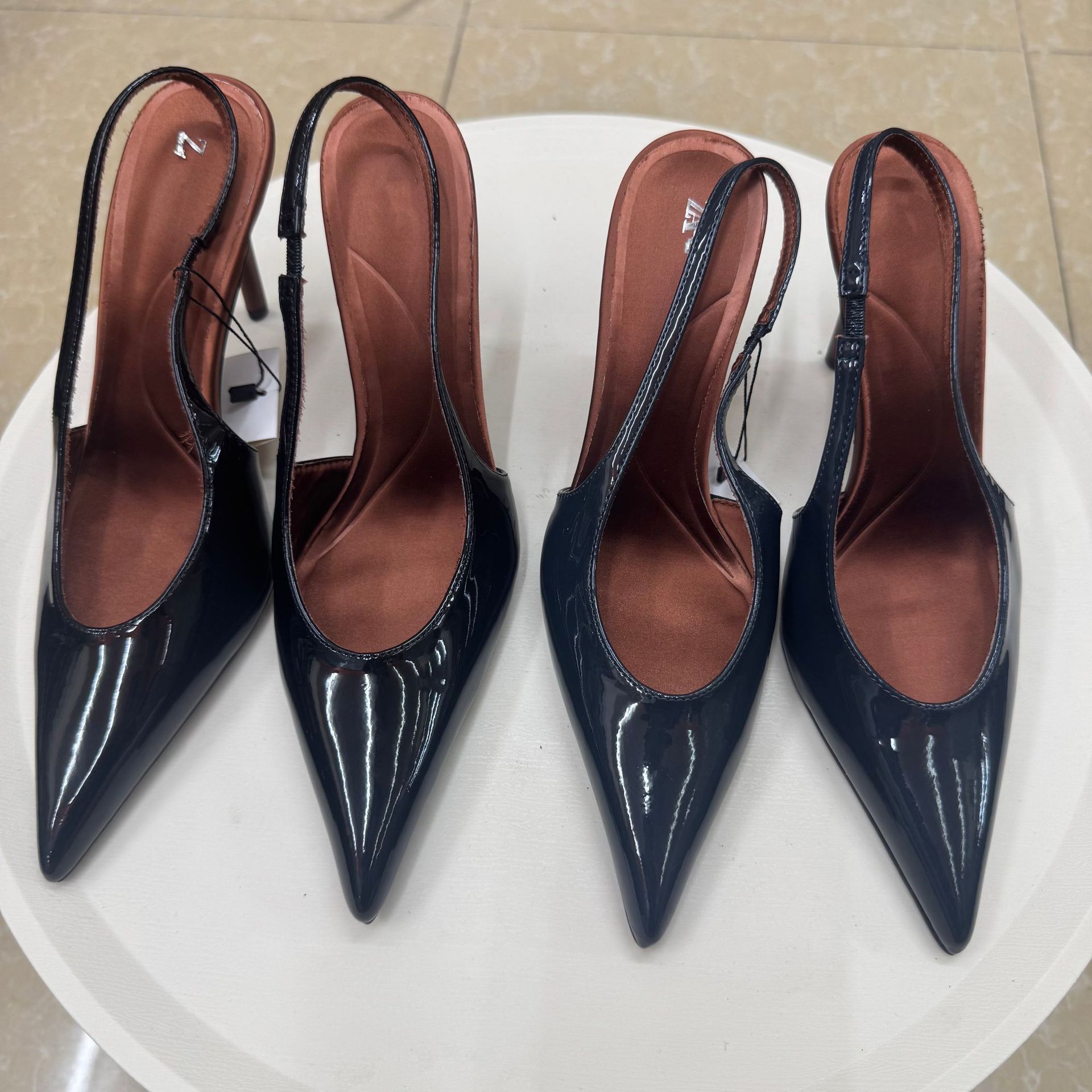 Fashionable professional shoes low-cut made of patent leather…