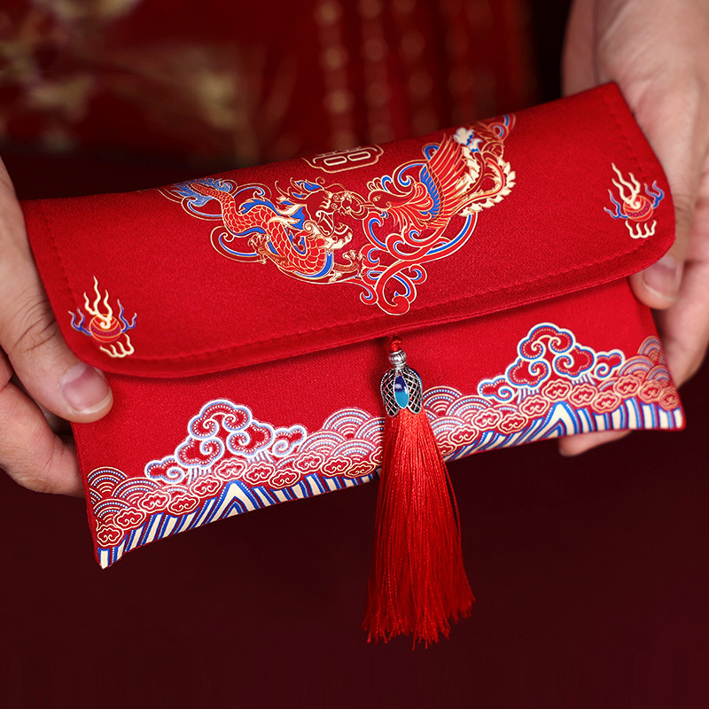 Casarse con el estilo nacional de tela de alta calidad sobre rojo brocado chino, el estilo chino es un regalo de Año Nuevo sellado y una boda de diez mil yuanes.