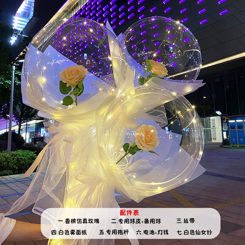 光る夜市の円形の赤い屋台のネットを並べてボールを押して会の風船のイルミネーションの明かりの告白のロマンチックな波の地帯のスーツを押します。|undefined