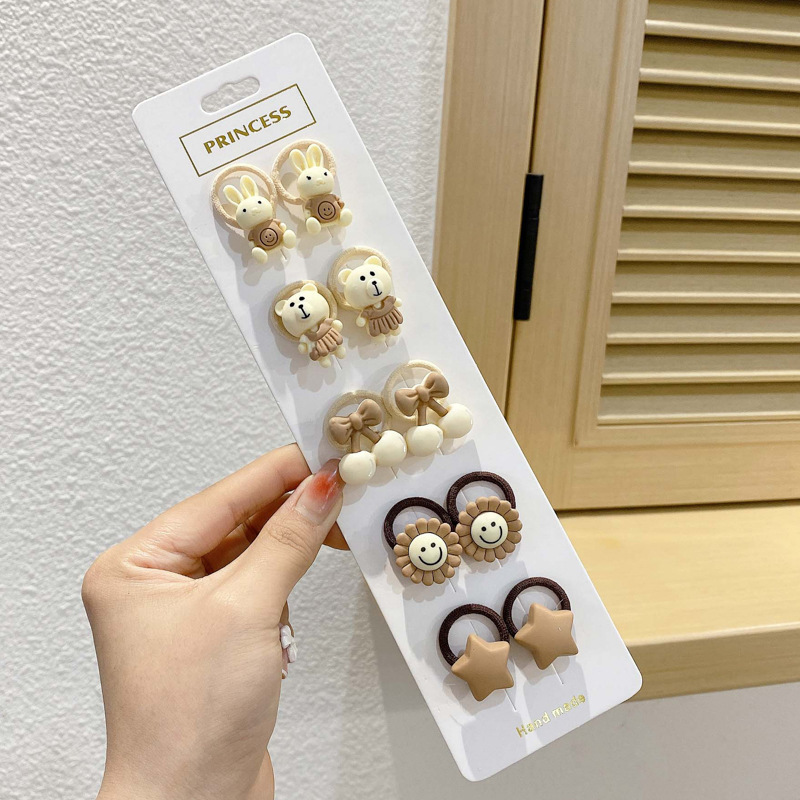 Los niños de la banda del pelo del bebé de la historieta no lastiman la banda de goma del pelo de la niña volumen del pelo menos cuerda del pelo del bebé