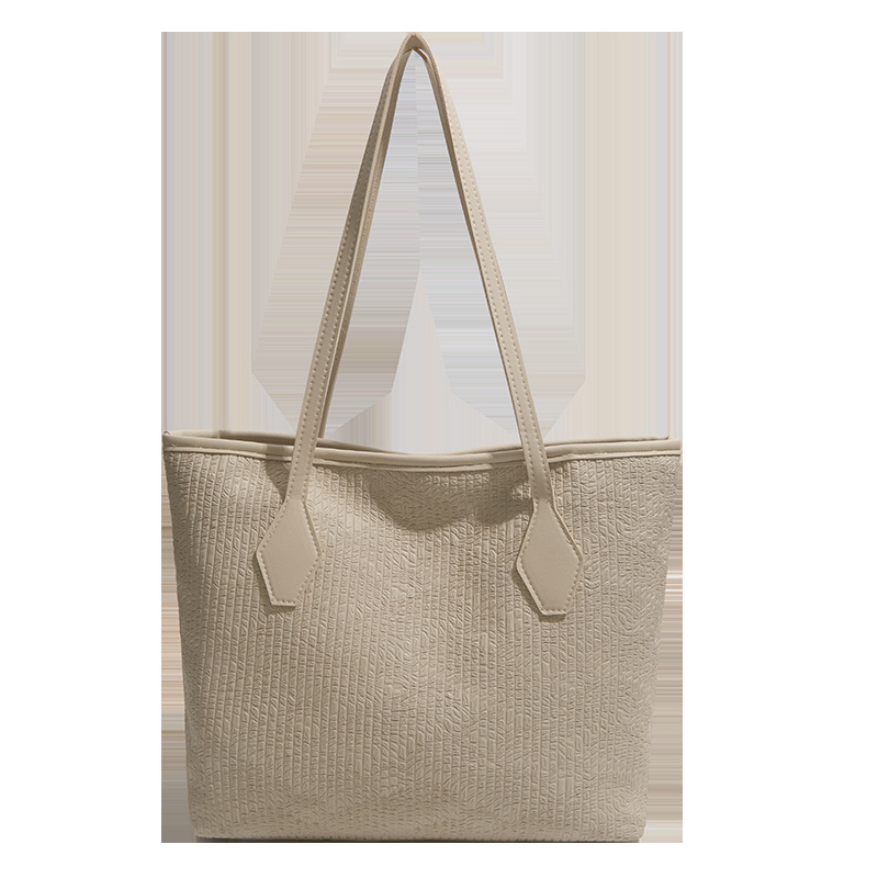 Bolsa de gran capacidad para mujeres 2026 nuevo estilo extranjero tejido de hombro brazo bolso de mano para salir bolsa de viaje