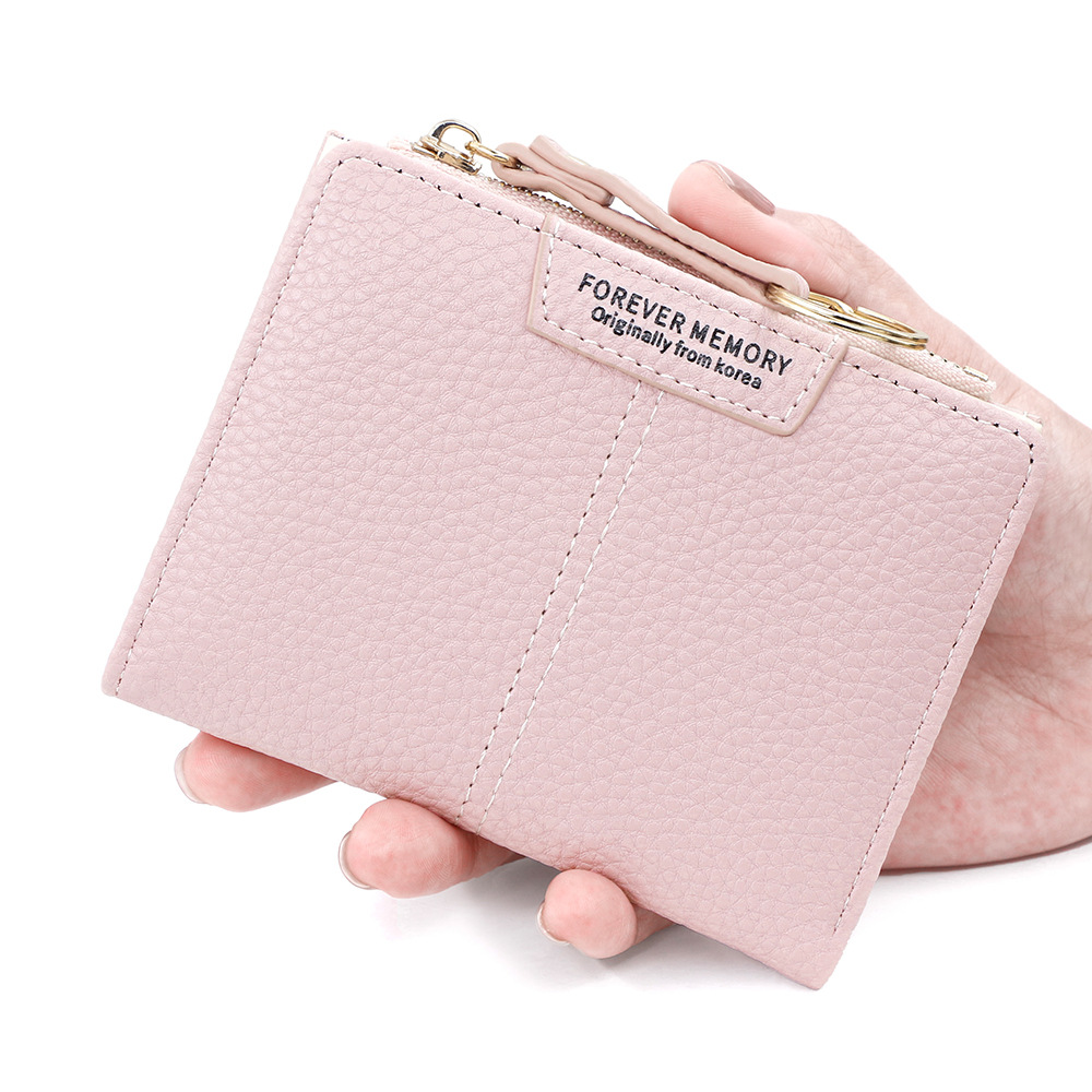 Versión coreana de la nueva billetera corta para mujer, llavero simple, billetera de monedas, billetera de dos pliegues para estudiantes al por mayor