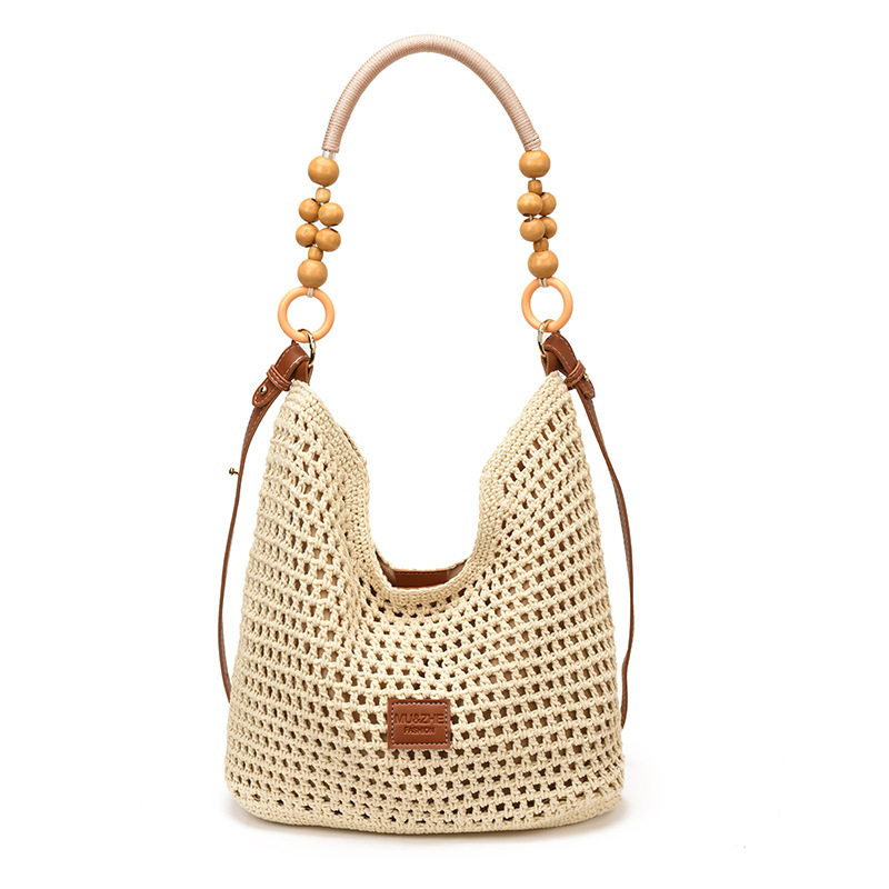 Bolsas de gran capacidad de tejido hueco para mujeres 2026 nuevas bolsas de playa de vacaciones en la playa de viaje nicho brazo Tote image 8