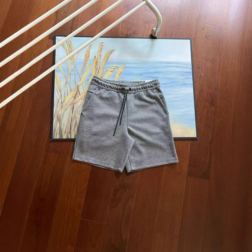 Verano nuevo estilo pequeño gancho versión en el extranjero de doce colores pantalones cortos deportivos de punto de pegamento lateral para hombres pantalones de cinco puntos 4503