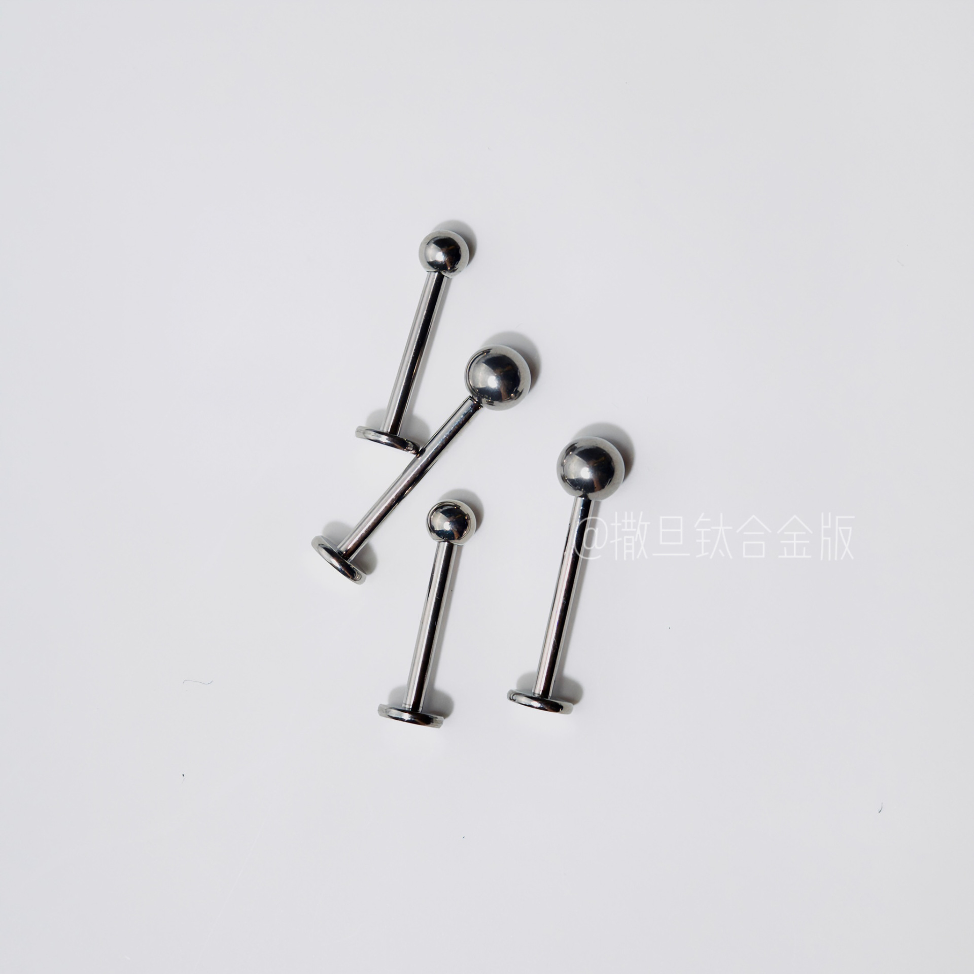 Silver pointed spike labret stud material detail