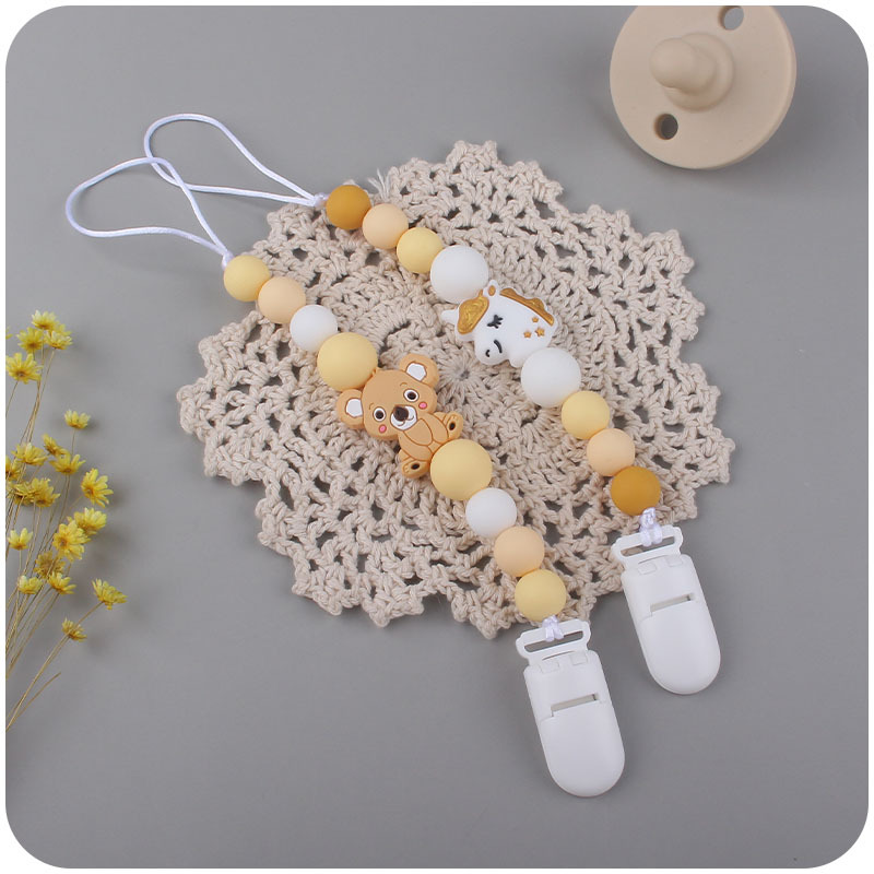 Bebé suministros de dibujos animados animal serie dos conjuntos Bebé dibujos animados unicornio mordedor pezón cadena anti-caída