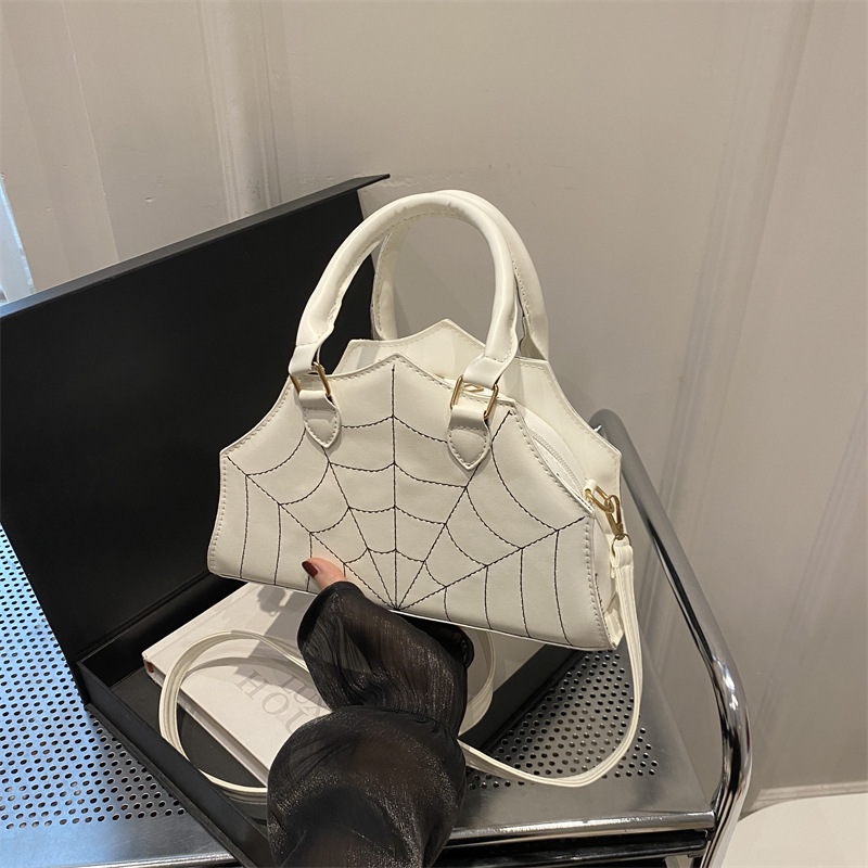 2024 nuevo bolso de tela de araña de moda personalidad extraña bolso de hombro en bordado simple bolso de mochila extranjero