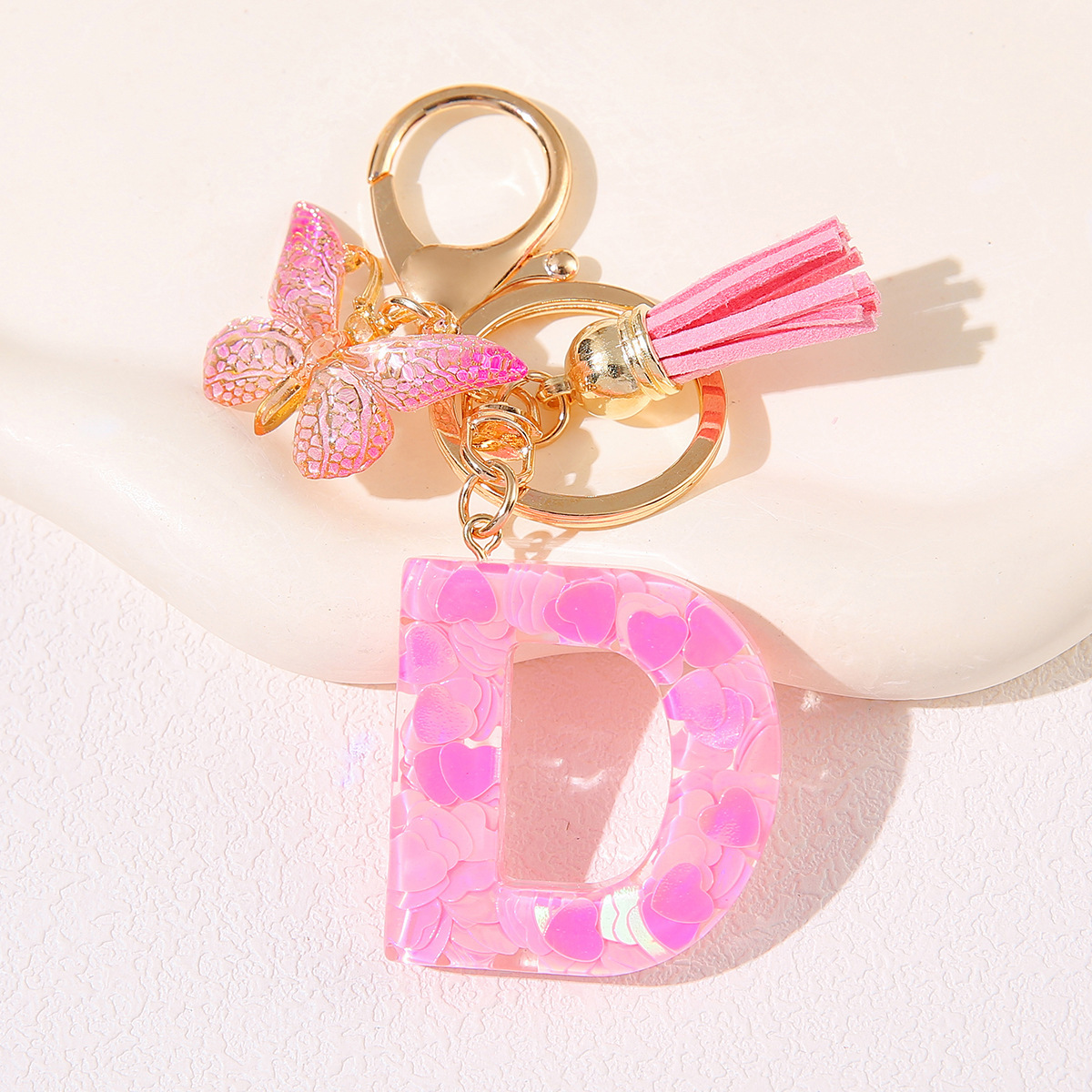 Nuevo rosa damas letras A-Z llavero de goteo de goma sequilla amor letras bordas mariposa llavero transfronterizo