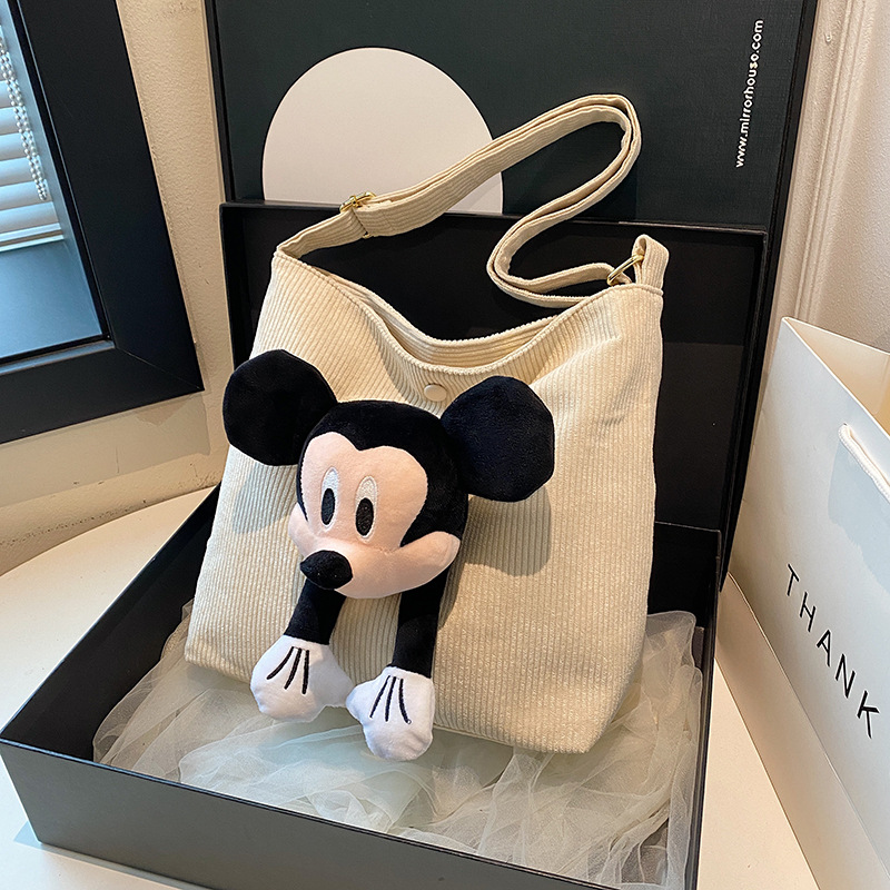 Bolso de lona de rayas de gran capacidad para mujeres de 2025, nuevo estilo de moda y lindo de Mickey Mouse, bolso tote para libros.