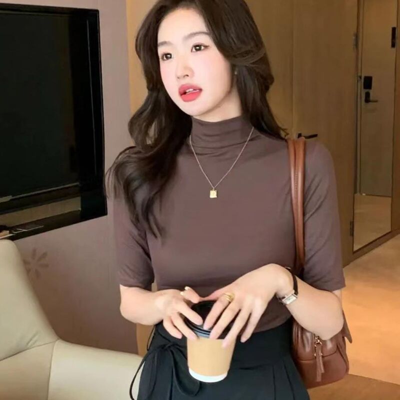 秋冬の小さい立襟の半袖のtシャツの女性の早秋の新型の韓国版は半高襟の5分の袖の純色の上着を身につけます。|undefined