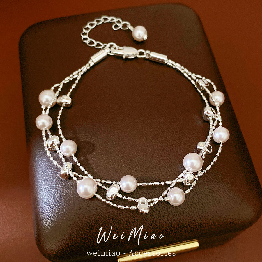 Pulseras de perlas redondas multicapa ligeras de lujo nicho pulseras de alta calidad temperamento de moda universal joyas al por mayor para mujeres