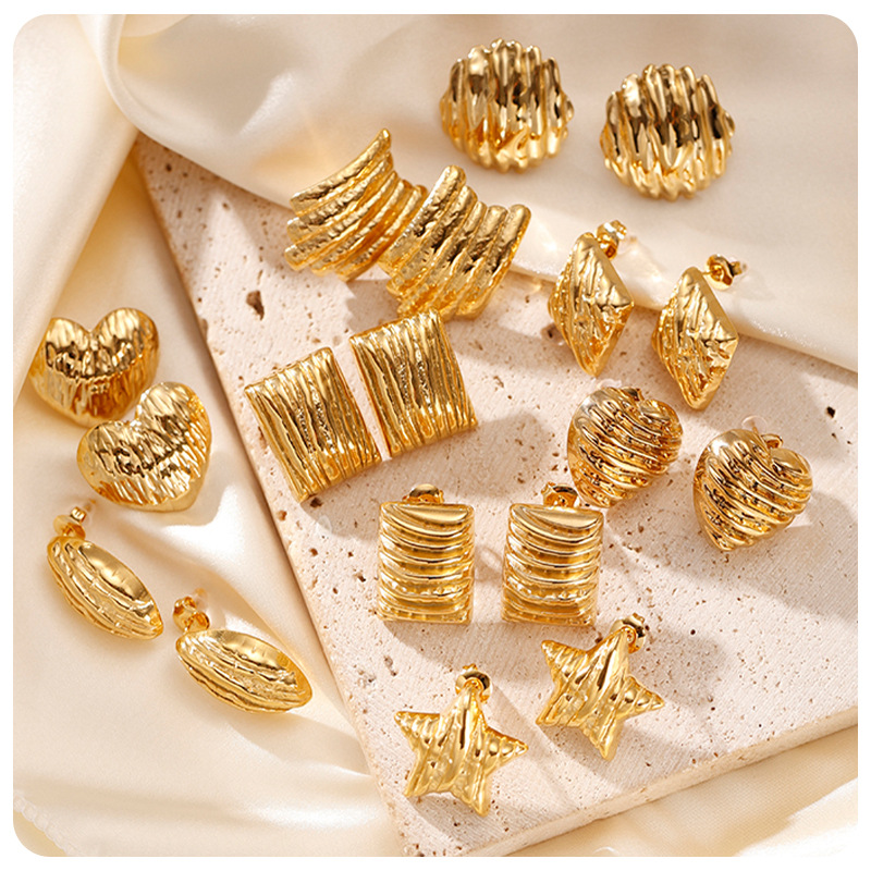 TENA transfronterizo de alta calidad texturas plegadas pendientes de acero inoxidable mujeres estilo de diseño de nicho simple pendientes de acero de titanio
