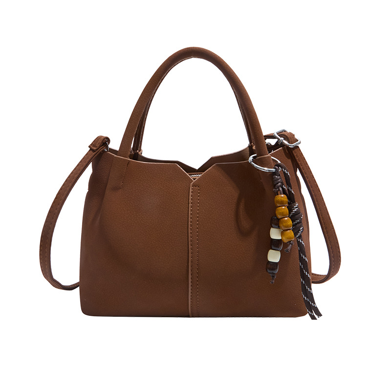 Bolso de mano de alta sensación de moda bolso de balde de mujer 2025 invierno retro simple bolso de hombro temperamento mochila de viaje