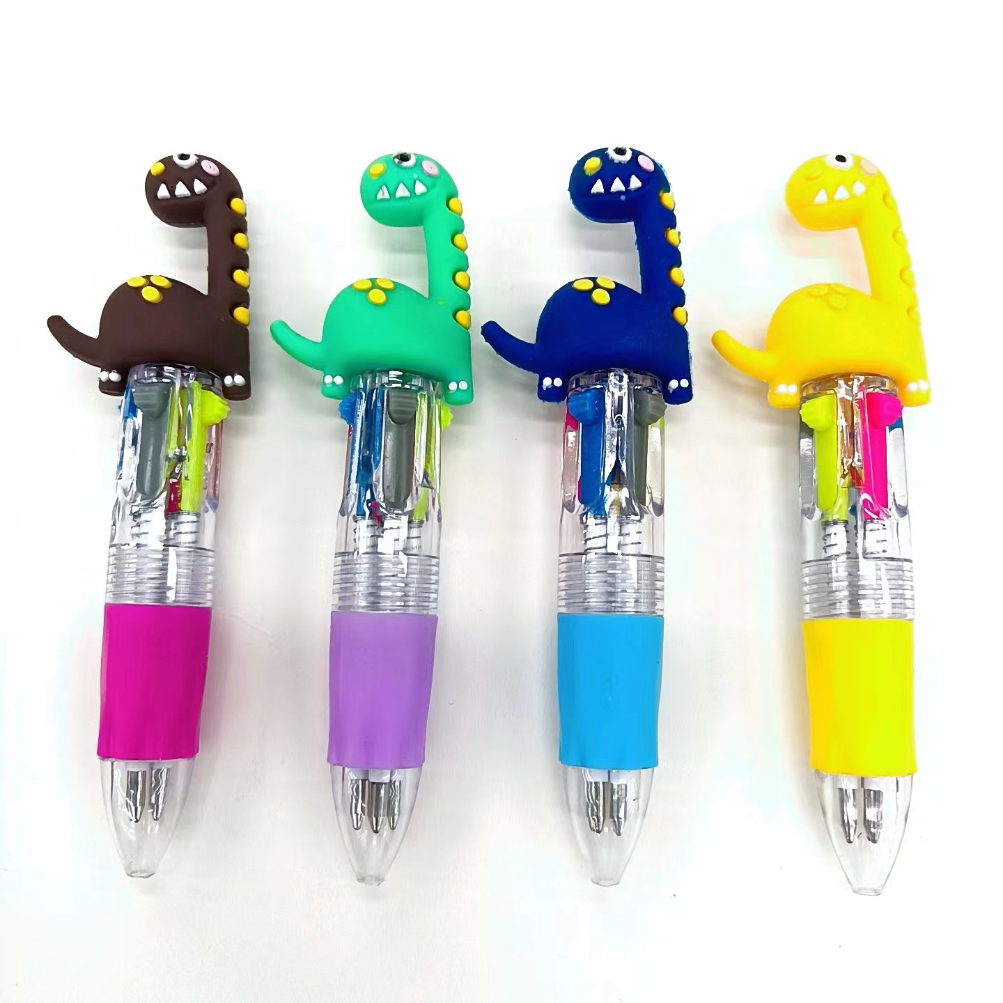 Fabricante mayorista de cuatro colores bolígrafo de silicona bolígrafo multicolor de dibujos animados cabeza portátil de estudiantes