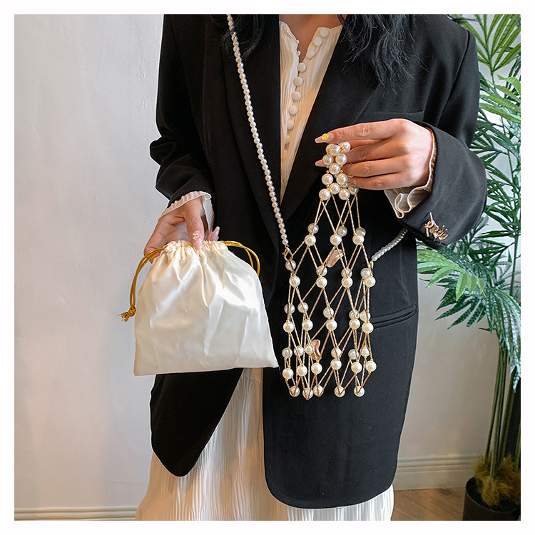 Women's Small Plastic Solid Color Vacation Beach Pearls Hollow String Beach Bag display picture 11