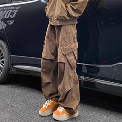 美ラードカレー色のカーブナイフの工装ズボンの男性のごろつきのかっこいい高級感のしわの傘の兵のズボンのゆったりしている広脚のカジュアルなズボン