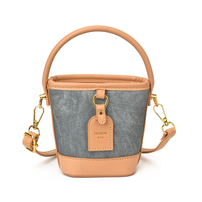 Mini pequeño bolso de cubo de mano para niños 2026 nuevo estilo de alta calidad de moda versátil bolso de mochila de estilo exterior