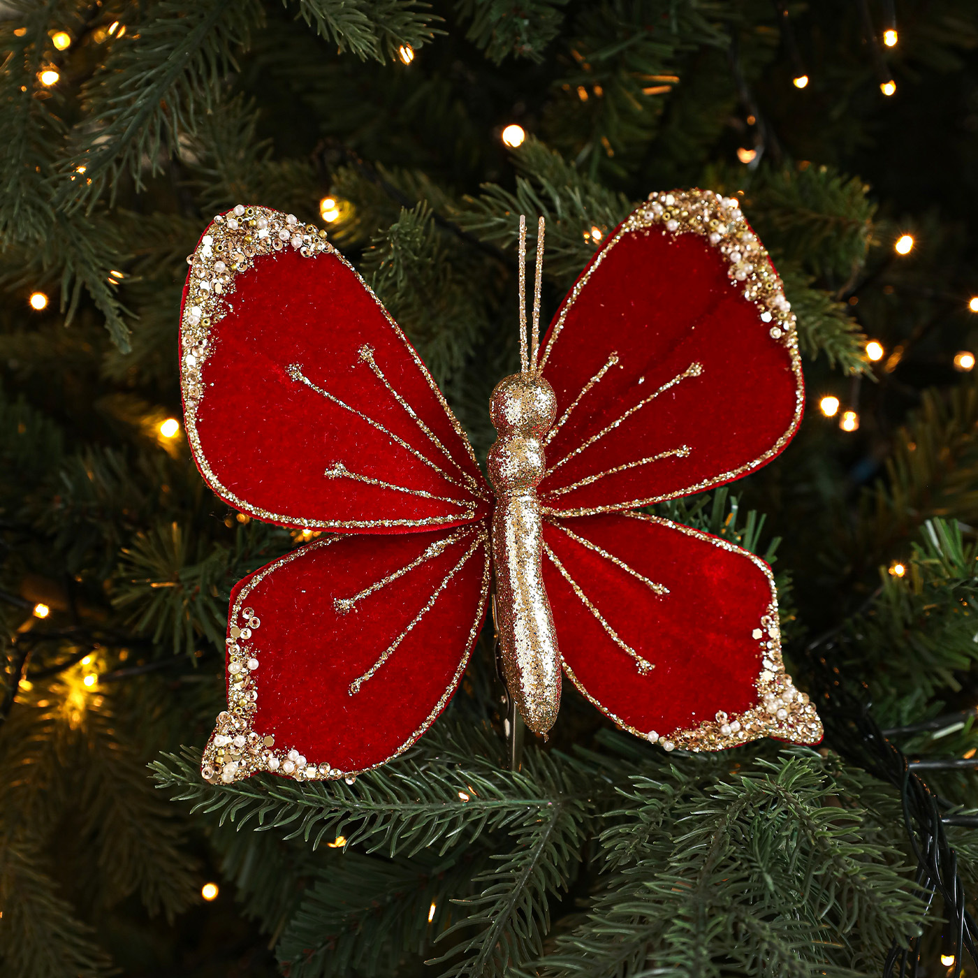 Nuevos productos de tela de alta calidad simulación de clip de arco de mariposa tela de vello polvo flocado árbol de Navidad decoración colgante diseño de escena
