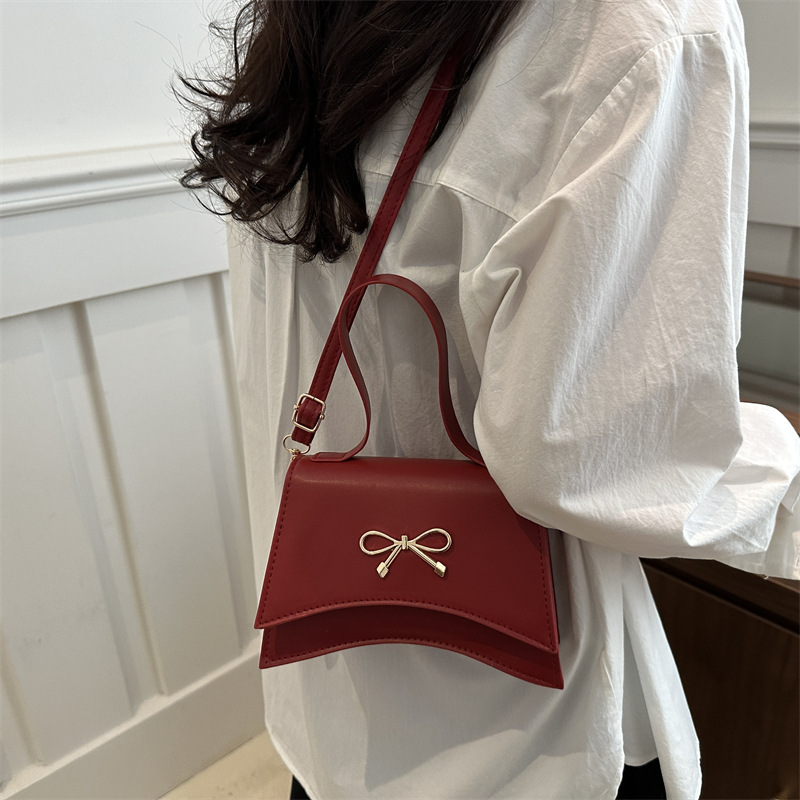 Nuevo diseño de nicho bowknot moda color sólido ins bandolera simple bandolera estilo occidental suave pequeño bolso cuadrado