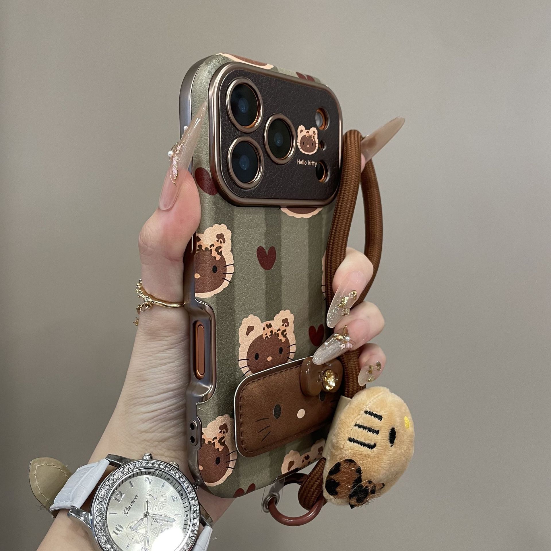 绿条纹KT猫适用苹果17promax手机壳新iphone16高级感全包镜头秋冬