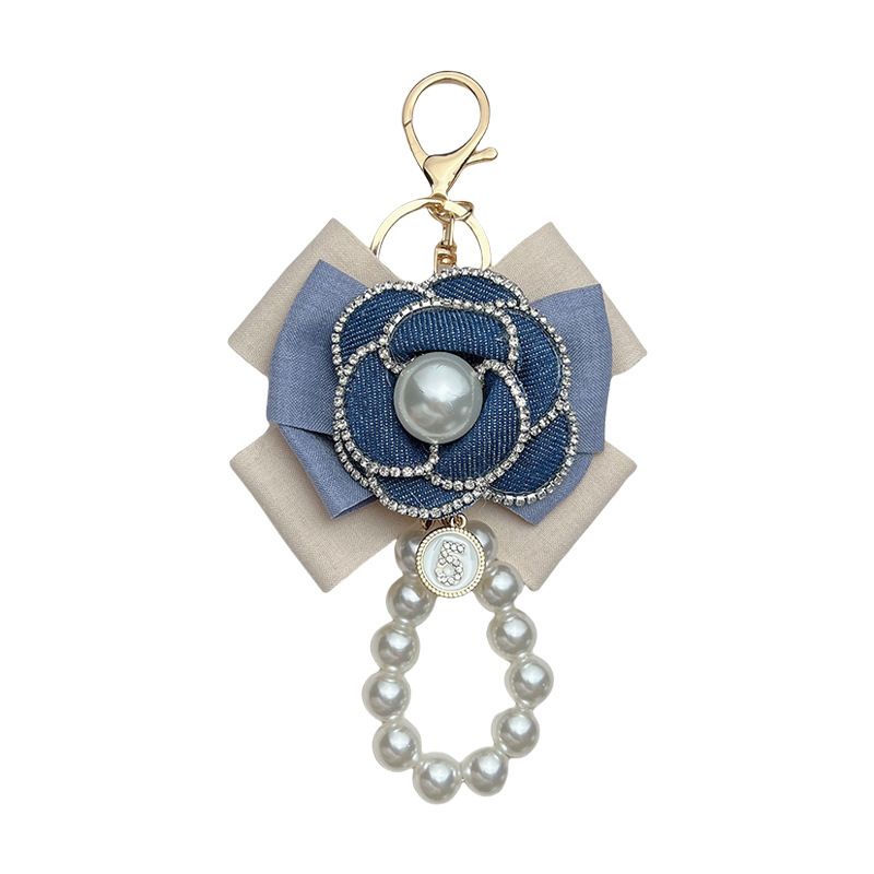 Personalidad de color vaquero arco camellia llavero perforación camellia cadena de perlas bolsos pequeños colgantes