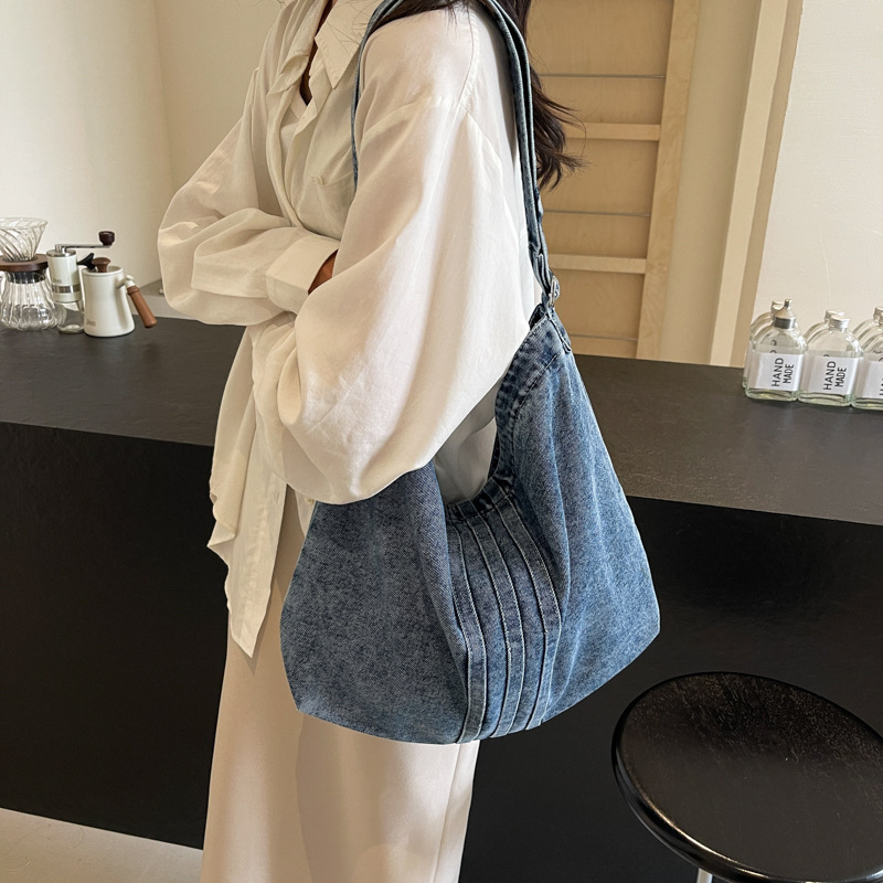Bolso de mezclilla lavado de viento perezoso para mujer 2025 nuevo bolso de lona literario bolso de hombro de gran capacidad al por mayor