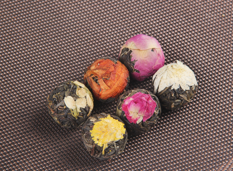 Yunnan Raw Pu-erh Flower Tea Dragon Balls Gift Box Six Floral Flavors 144g in use