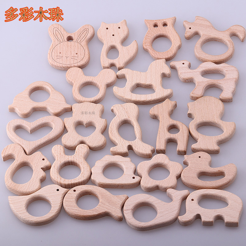 Suministro directo de fábrica al por mayor de animales de haya, anillos de madera, molares de madera para bebés de madera, juguetes y accesorios de joyería