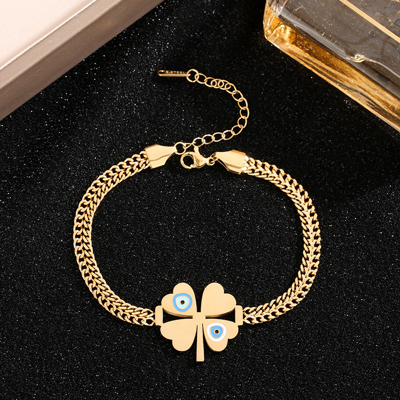 Amazon venta al por mayor transfronteriza Europa y América de moda ojos azules cuatro hojas colgante pulseras de acero joyas al por mayor
