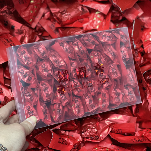 Tieguanyin tea, Anxi Da Hong Pao, Jin Jun Mei, and Xiao Zhong in a PC box, packaged as a viral high mountain black tea, shipped individually.