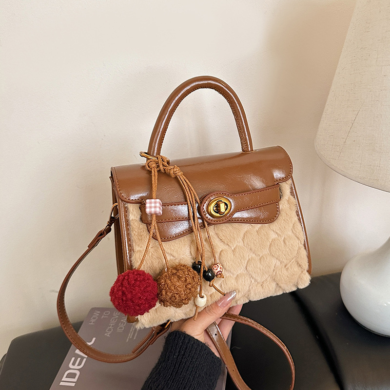 Otoño y invierno de alto nivel bolso de lana portátil para mujeres 2025 nuevo nicho Zhong commuting bolso de hombro bolso casual Kelly