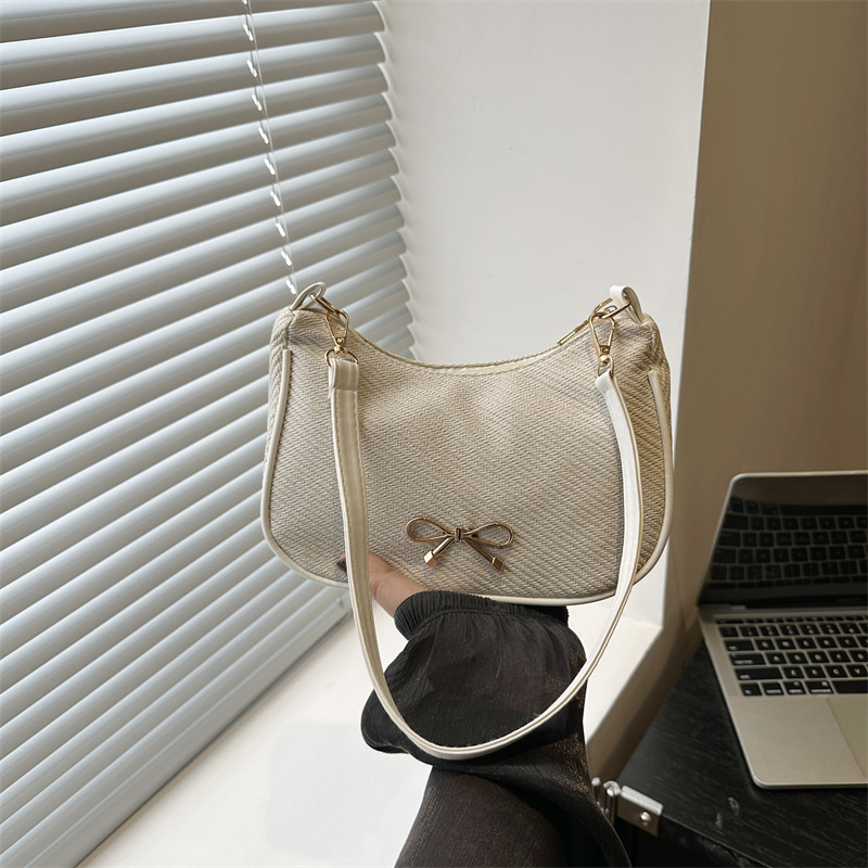 Bolsos populares de este año para mujer 2025 nuevo estilo de alta gama moda de un solo hombro bolsa de axila de diseño de nicho bolsa de bola de masa de axila