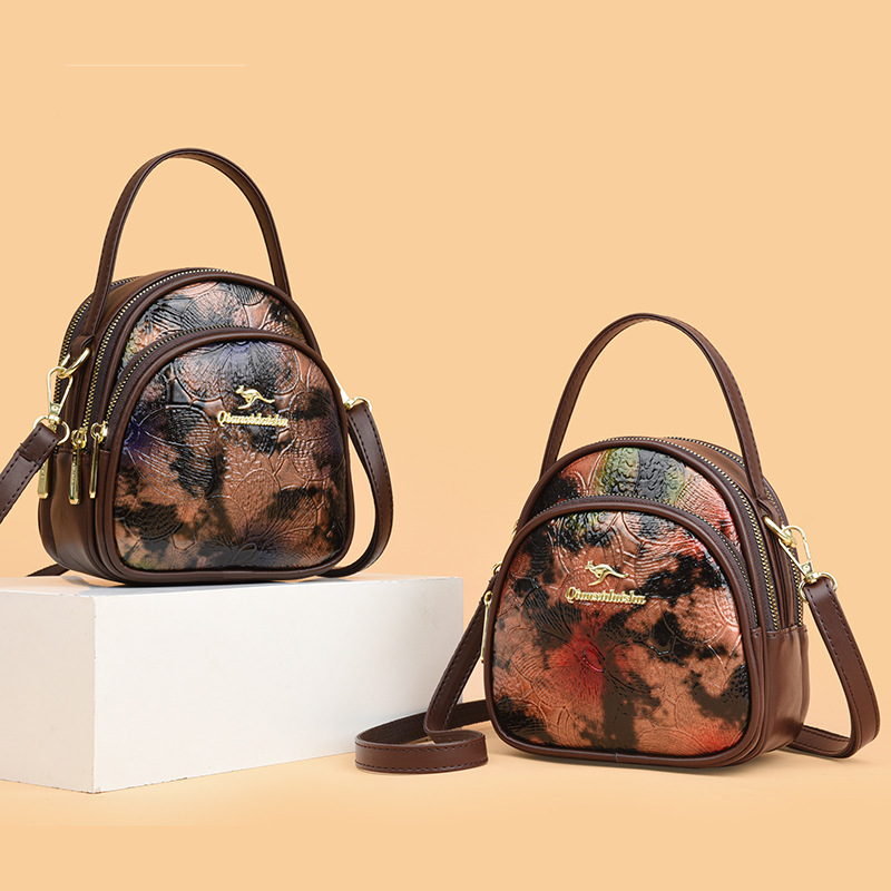 Bolsa de moda transfronteriza de madres de mediana edad, bolso de hombro de impresión de cuero blando, 2024 nuevo estilo chino de damas, bolso de mochila