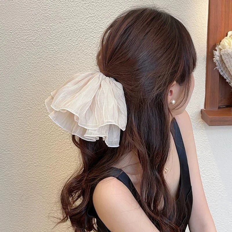 Correa coreana arco de mariposa intestino 2025 cabello anillo de cabello de cabello de cola de cabello de la niña decoración de invierno invierno decoración de invierno