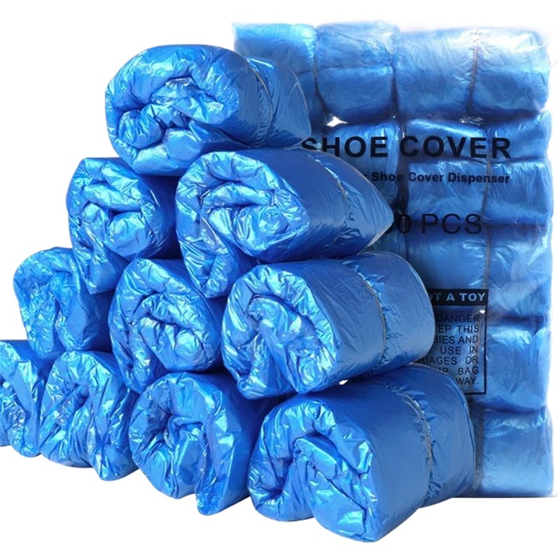 Fábrica al por mayor desechable PE cubierta de zapatos no tejida cubierta de pie engrosada hogar T-tipo máquina de plástico zapatos película antideslizante
