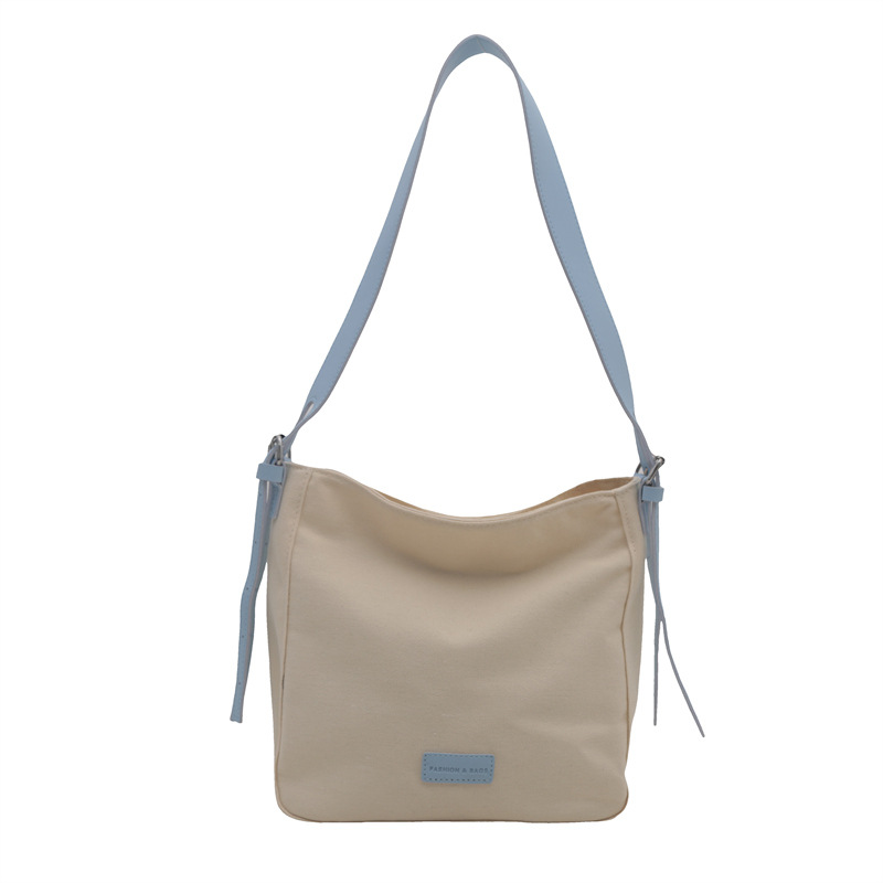 Bolso bandolera de lona de moda para mujer 2024 marea de otoño nuevo estilo de gran capacidad de costura de color de contraste viaje a clase bolso de viaje