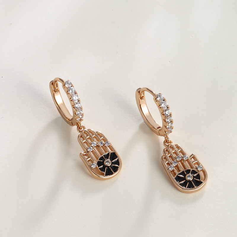 Xuping Cross - Border Fashion Orejeras europeas y americanas pendientes de nicho de lujo ligero y de alta gama ligeramente incrustados con zircon Palm Alloy Orejeras femeninas