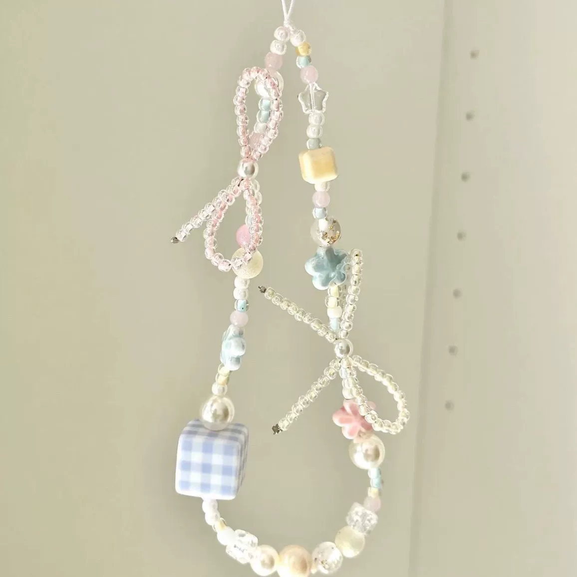 Brand mobile phone with bow, camera, strap, pendant, flowered