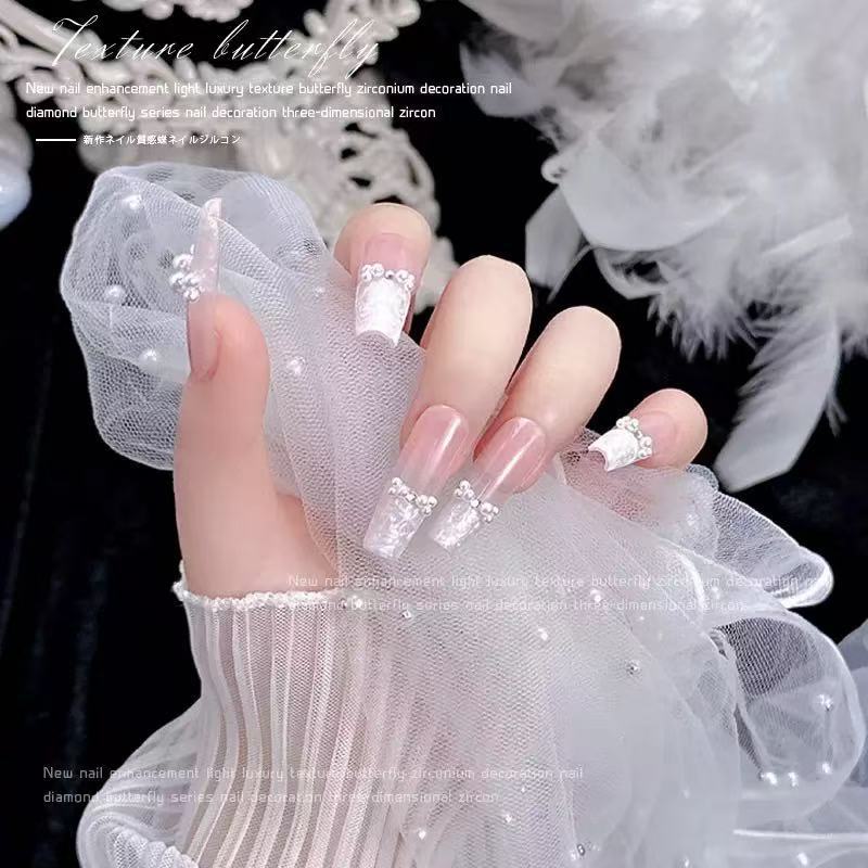 Joyas de manicura de perlas blancas puras no se desprenden de la piel de la bolsa plana de fondo redondo medio redondo de perlas brillantes de uñas especiales