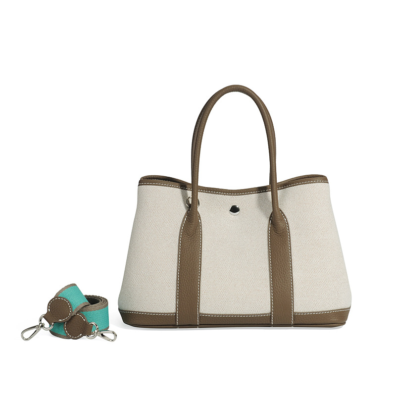 大容量ガーデンバッグキャンバスは色にぶつかった本革のトップ層牛革をつなぎ合わせて、シングル肩のショッピングバッグを持っています。