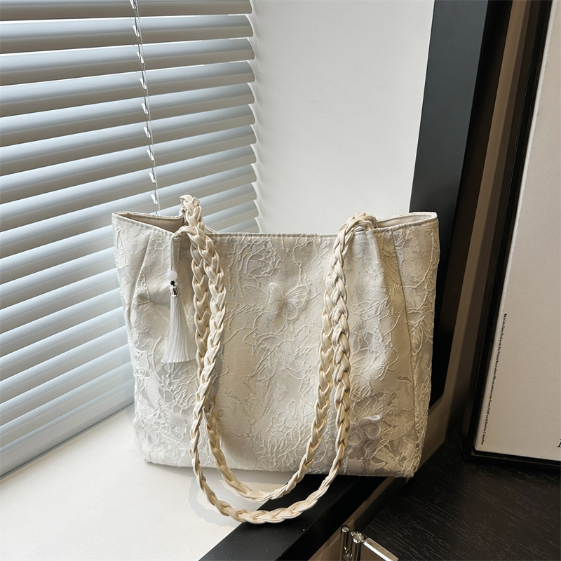Bolso de viaje de seda de mariposa de alta calidad de nicho 2025 verano nuevo bolso de mujer simple de gran capacidad nuevo estilo chino