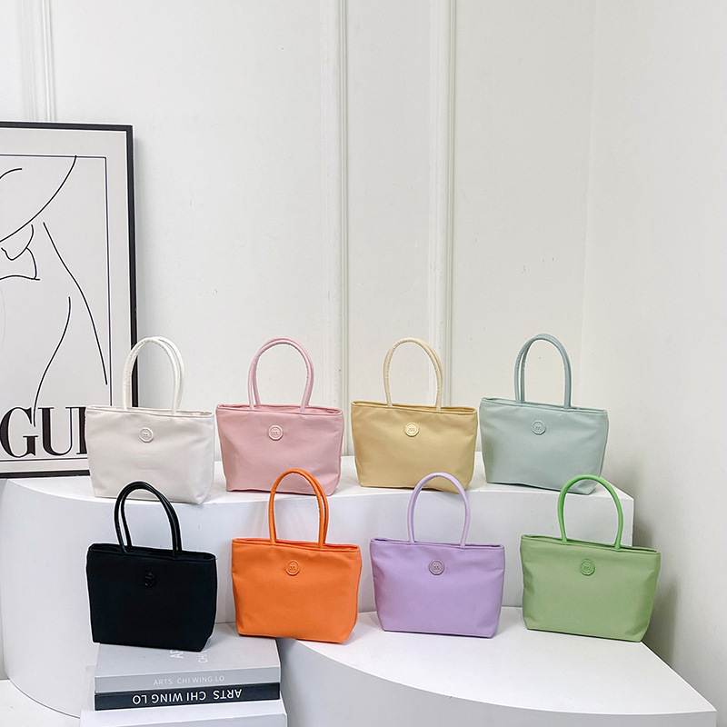 This year's popular new ins Korean version solid color nylon simple texture niche tote bag versatile fashion handbag