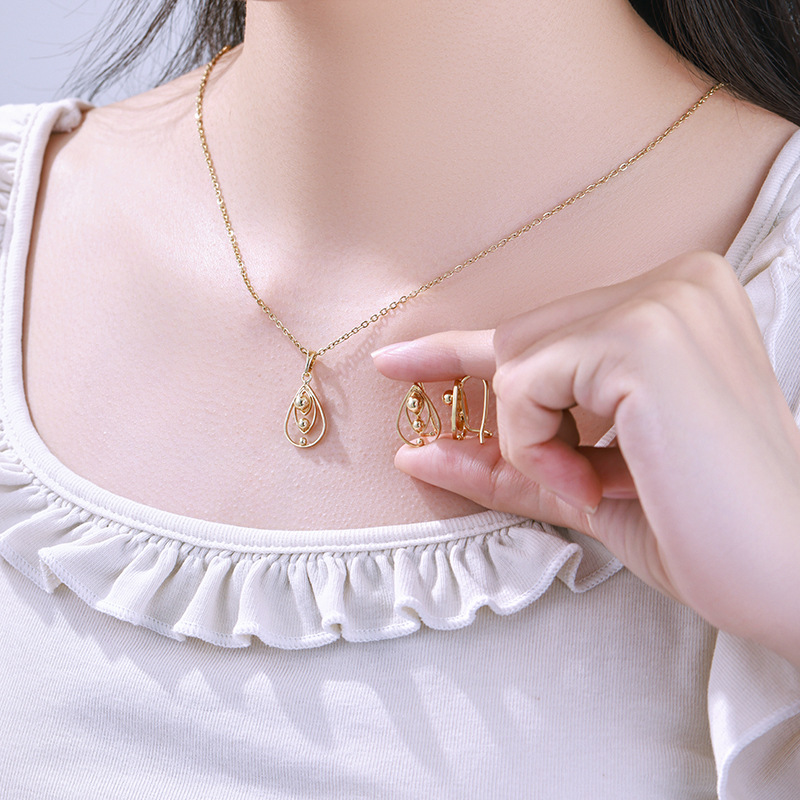 Xuping aleación de cobre 14k nicho de diseño de personalidad transfronteriza aretes de viento colgante conjunto de joyas mujeres image 5